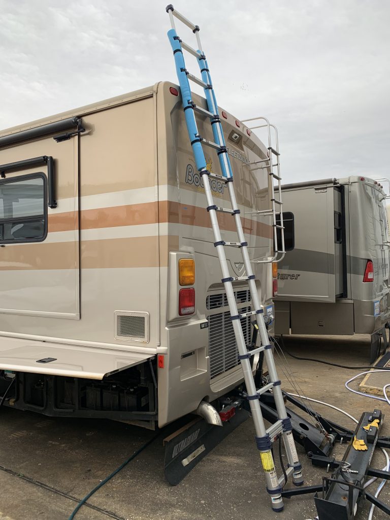 Ladder against back of motorhome